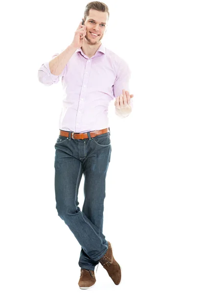 Young man talking on the phone - full length shot isolated — Stock Photo, Image