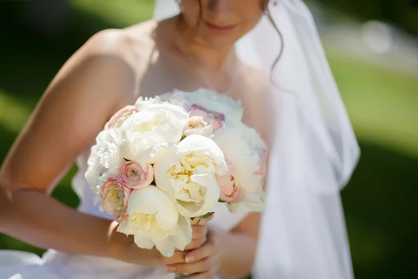 Delicate bridal bouquet of roses and peons — Stock Photo, Image