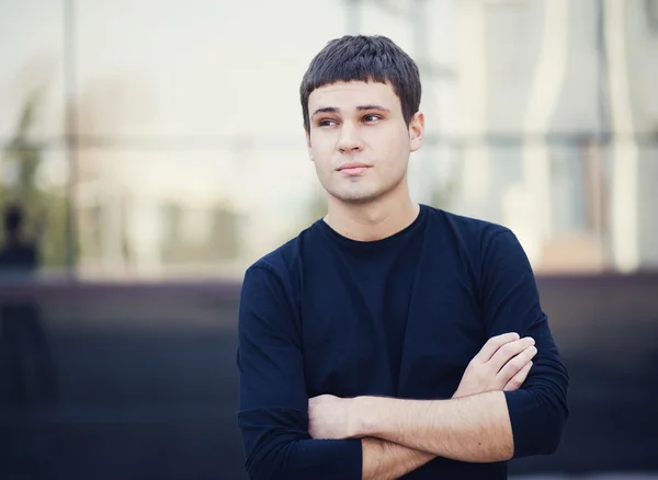 Portrait of a young attractive man in city — Stock Photo, Image