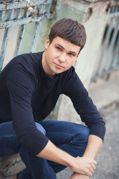 Portrait of young attractive man on a vintage background — Stock Photo, Image