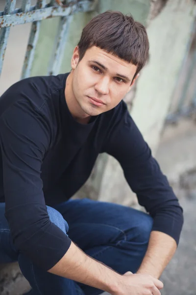 Portrait of young attractive man on a vintage background — Stock Photo, Image