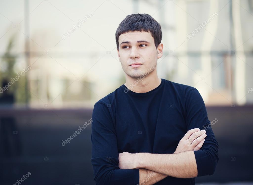 portrait of a young attractive man in city