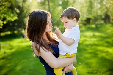 A mother and son outdoors 