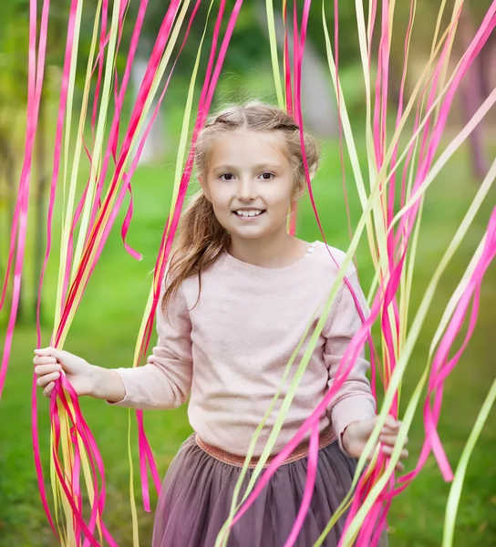 Little girl on a children's holiday — Stock Photo, Image