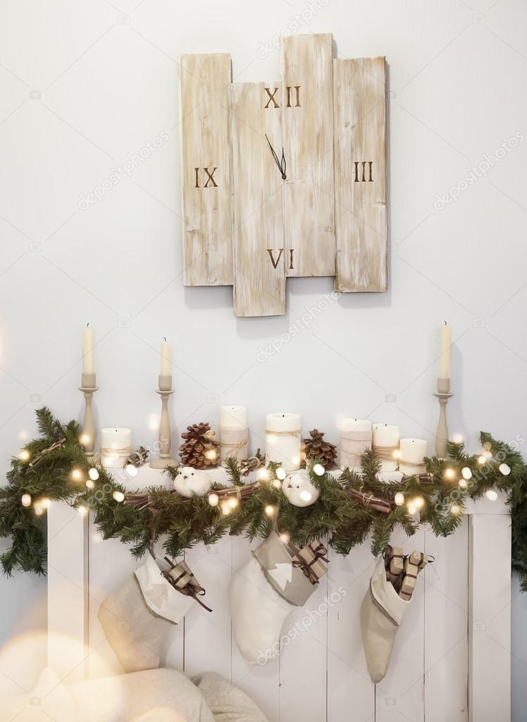 Christmas decoration with fireplace and the clock