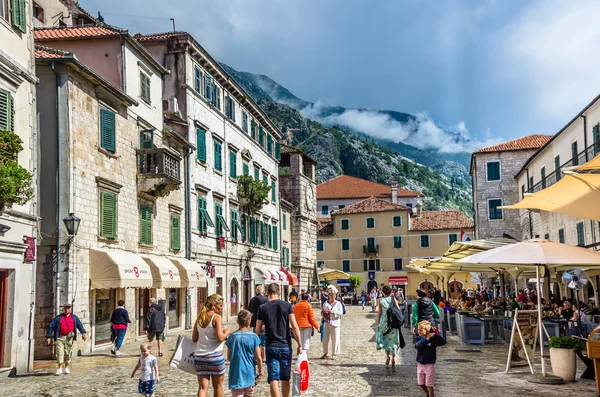 People walking on old town street — Stock Photo, Image