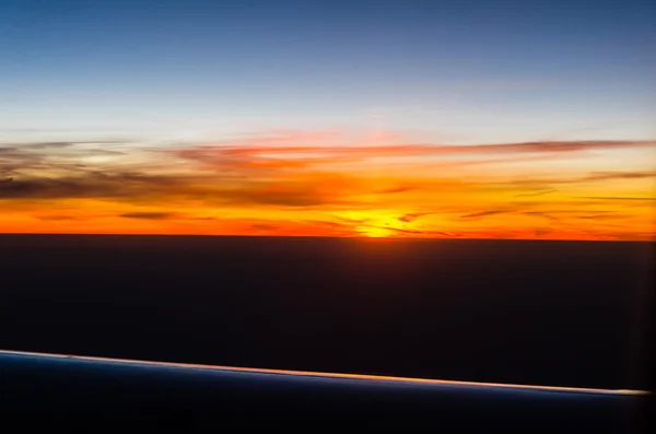 Pôr do sol vista do avião — Fotografia de Stock