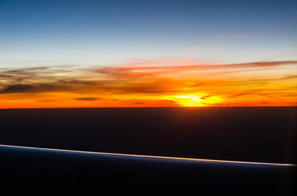 Pôr do sol vista do avião — Fotografia de Stock