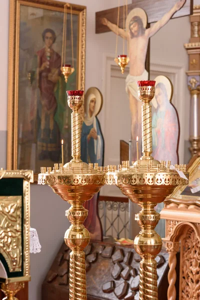 Golden candle in church — Stock Photo, Image