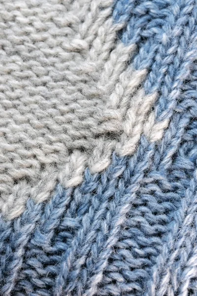 大きな機械編みの男性の毛織のセーターの断片の織物のテクスチャの背景クローズアップマクロ写真 — ストック写真