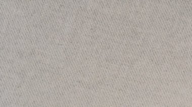 Tekstil video arkaplanı yavaşça ışık peçetesini yakın çekimde döndürür