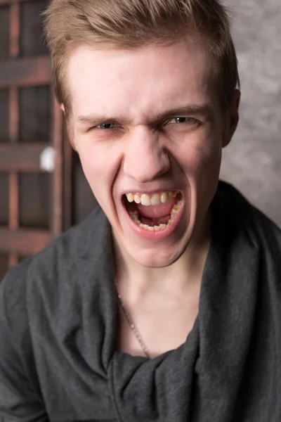 Portrait of screaming young men — Stock Photo, Image