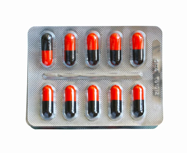 Packing Red Black Capsules Isolated White Background — Stock fotografie