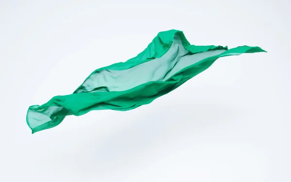 Pedaço abstrato de tecido verde voando — Fotografia de Stock