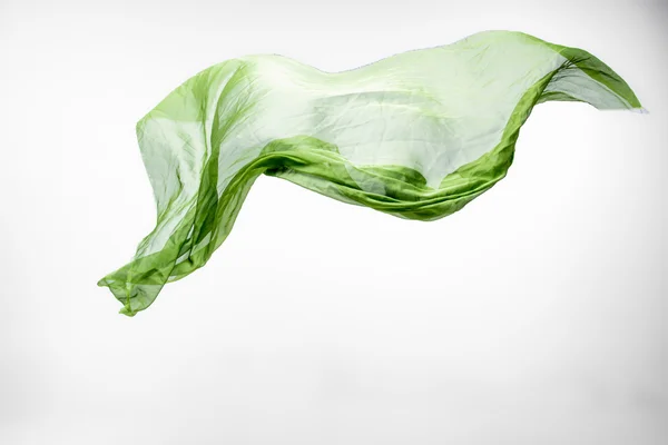 Abstract piece of green fabric flying — Stock Photo, Image