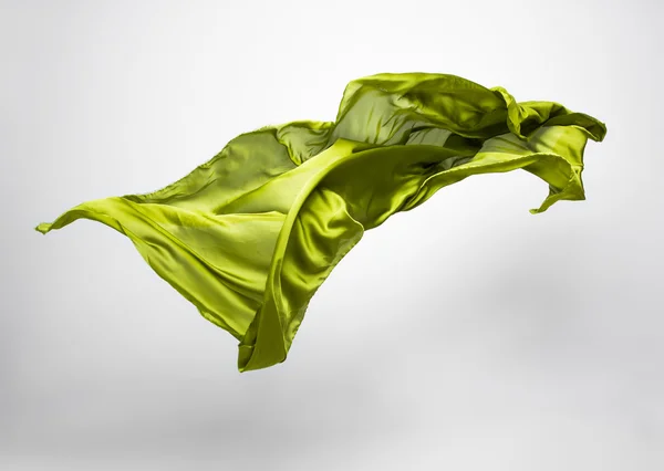 Abstract piece of green fabric flying — Stock Photo, Image