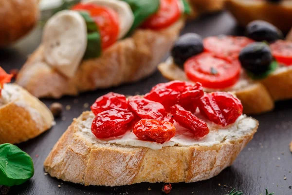 Bruschetta with dried cherry tomatoes — Stock Photo, Image