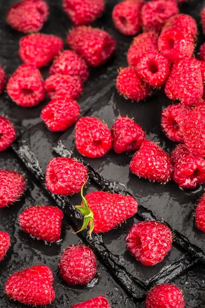 Fresh red raspberries on a slate background — Stock Photo, Image