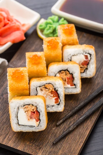 Fried sushi roll with salmon teriyaki — Stock Photo, Image