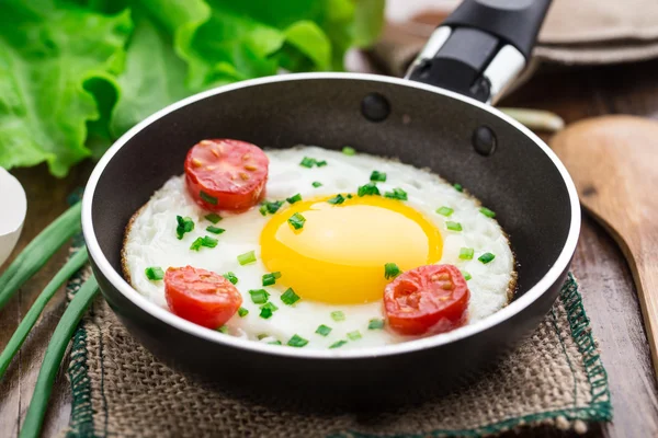 Fried egg in a small pan — Stock Photo, Image