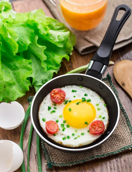 Fried egg in a small pan — Stock Photo, Image