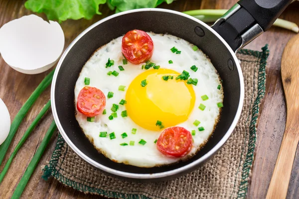 Fried egg in a small pan — Stock Photo, Image