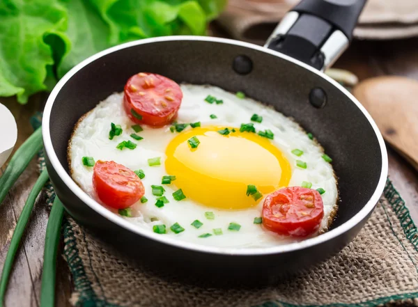 Fried egg in a small pan — Stock Photo, Image