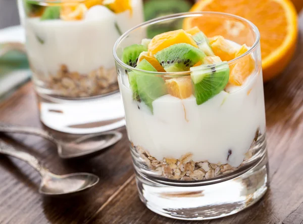 Yogurt with muesli and fruits — Stock Photo, Image