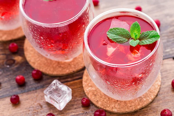 Cranberry cocktail with mint garnish. — Stock Photo, Image