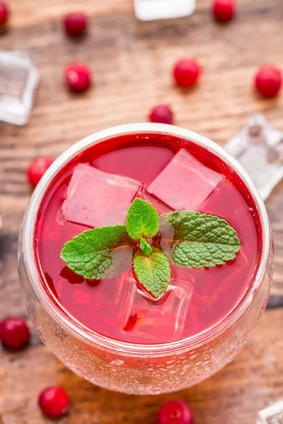 Cranberry cocktail with mint garnish. — Stock Photo, Image