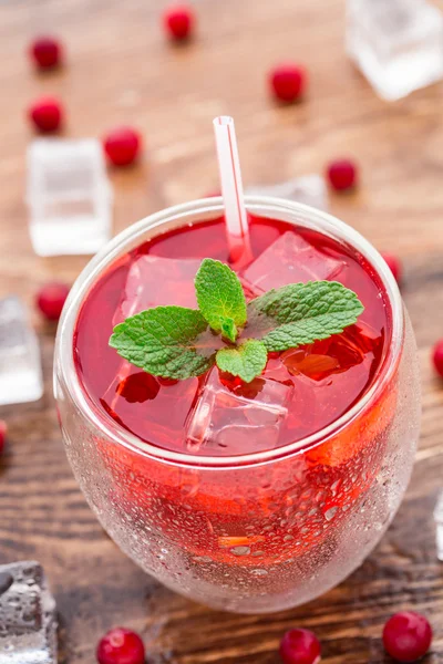 Cranberry cocktail with mint garnish. — Stock Photo, Image