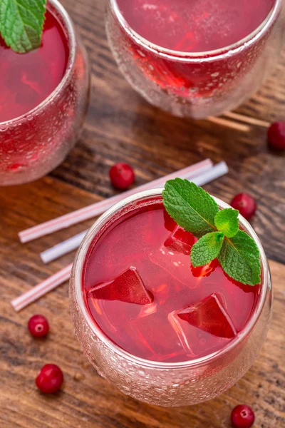 Cranberry cocktail with mint garnish. — Stock Photo, Image