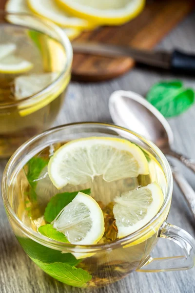 Cup with mint and lemon tea — Stock Photo, Image