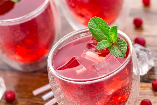 Cranberry cocktail with mint garnish. — Stock Photo, Image