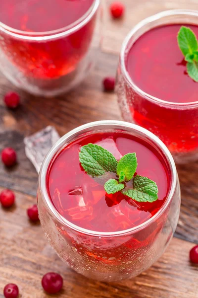 Cranberry cocktail with mint garnish. — Stock Photo, Image