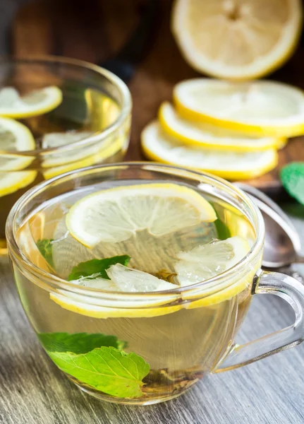 Cup with mint and lemon tea — Stock Photo, Image