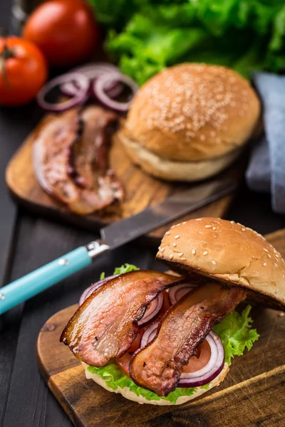 Home made burger on wooden board — Stock Photo, Image