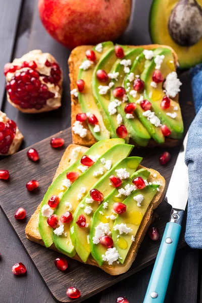 Avocado sandwich with feta and pomegranate — Stock Photo, Image