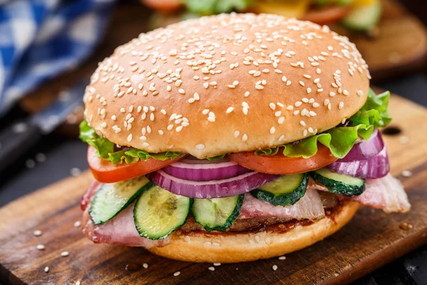 Bacon burger with vegetables and cutlet — Stock Photo, Image