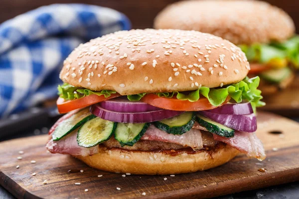 Bacon burger with vegetables and cutlet — Stock Photo, Image