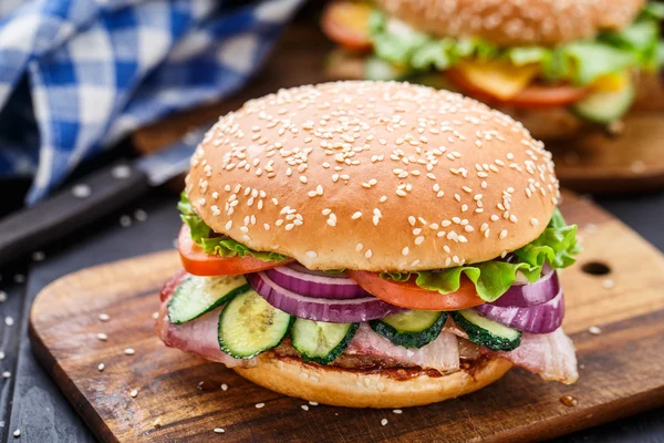 Bacon burger with vegetables and cutlet — Stock Photo, Image
