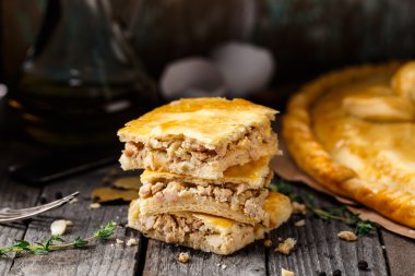 Homemade pie stuffed with chicken ang eggs clipart