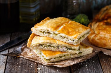 Homemade pie stuffed with chicken ang broccoli clipart