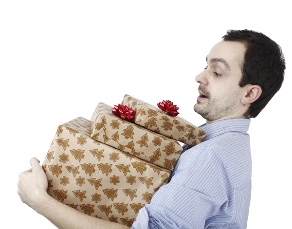 Young man holding a present Royalty Free Stock Images