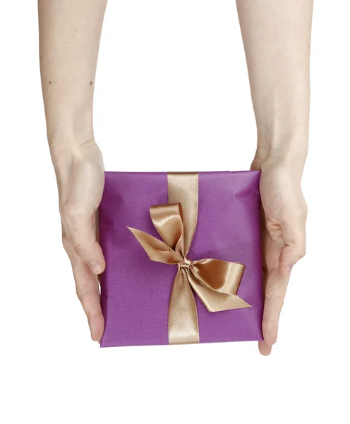 Young woman holding a present — Stock Photo, Image