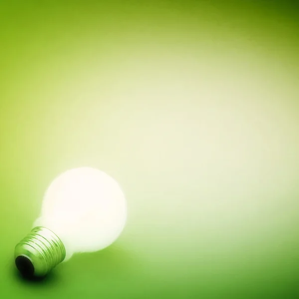 Background with lit lightbulb Royalty Free Stock Photos