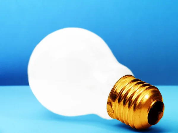 White BULB - blue background — Stock Photo, Image