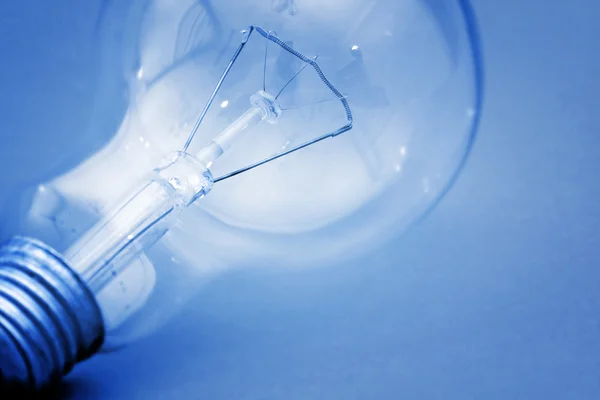 Background with lit lightbulb — Stock Photo, Image