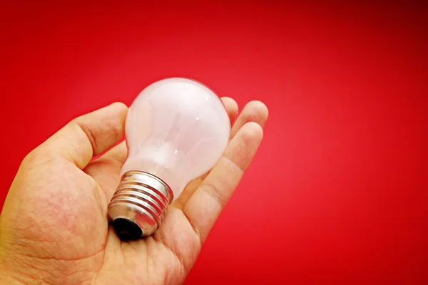 Background with lit lightbulb — Stock Photo, Image