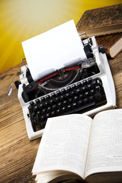 Retro typewriter with books — Stock Photo, Image